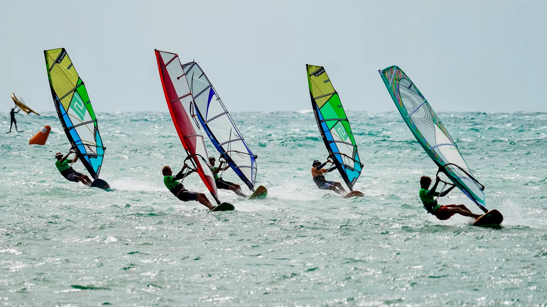 Windsurfers racing side by side at the Wave Rally World Championships