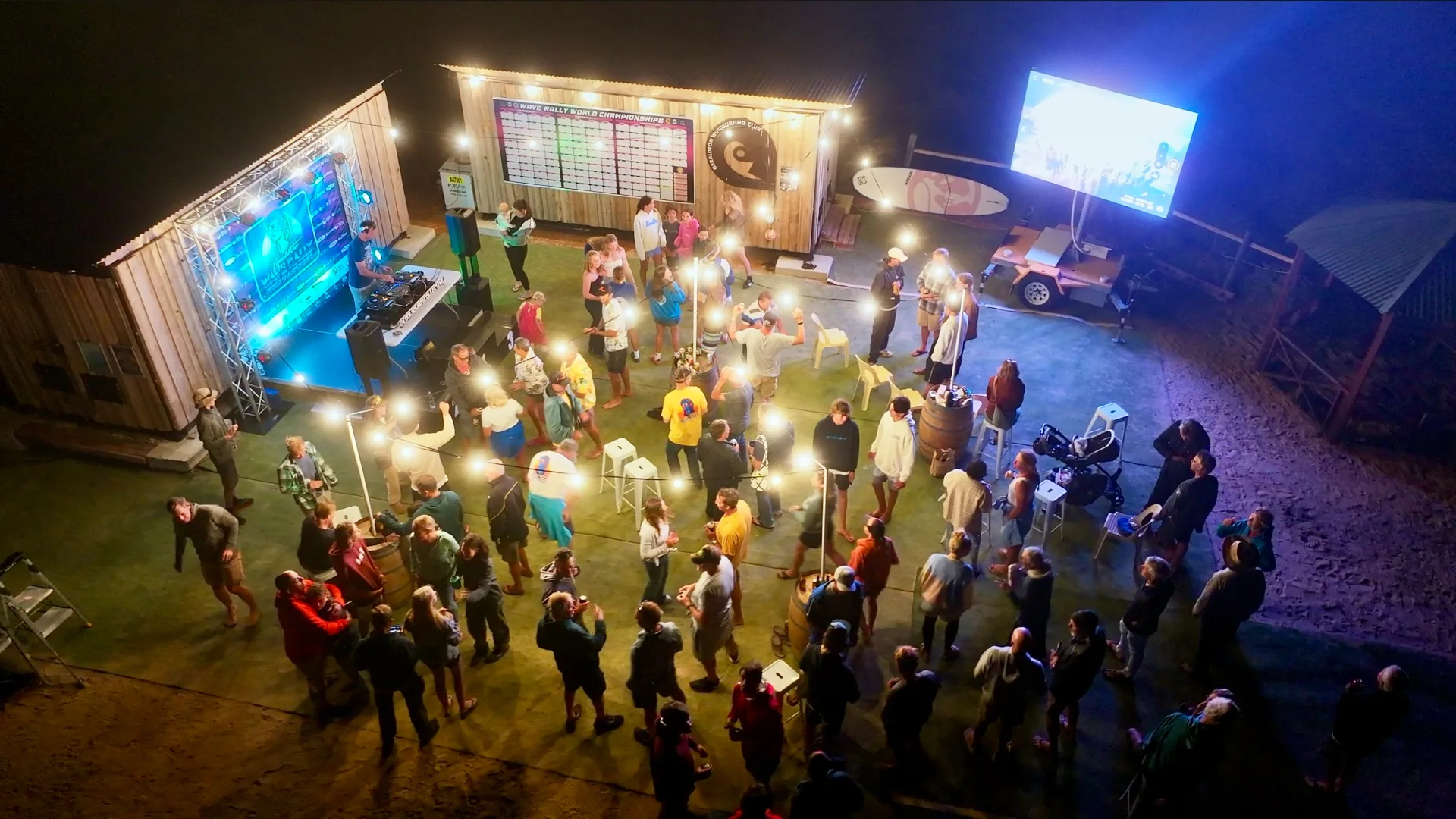 Wave Rally beach party with music and blue lights after racing